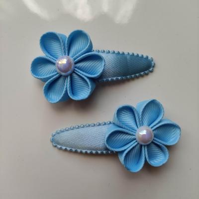 lot de 2 barrettes clic clac fleurs bleu ciel B116