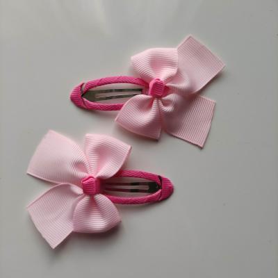 lot de 2 barrettes clic clac  noeuds gos grain rose   B134