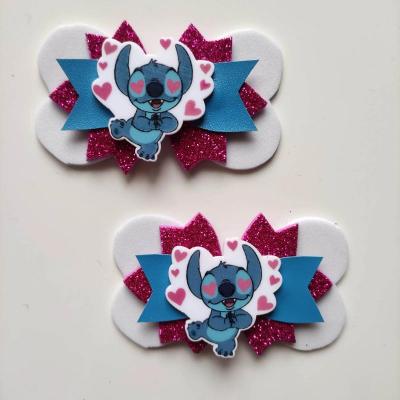 STIT002 Lot de 2 barrettes crocodile noeuds bleu blanc et  rose stitch