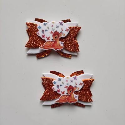 BAMB004 Lot de 2 barrettes crocodile noeuds orange et blanc faon bambi