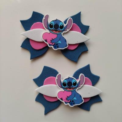 STIT006 Lot de 2 barrettes crocodile noeuds bleu blanc et rose stitch