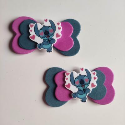 STIT007 Lot de 2 barrettes crocodile noeuds bleu et rose  stitch